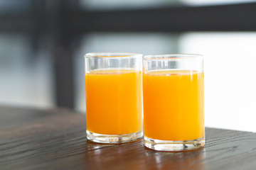 Closeup orange juice on wood table, drink for healthy concept, selective focus
