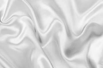 Obraz premium The texture of the satin fabric of white color for the background