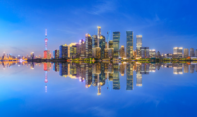Naklejka premium Shanghai skyline with modern urban skyscrapers at night,China