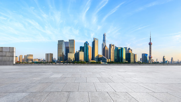 Shanghai skyline and modern city skyscrapers with empty floor at sunset,China