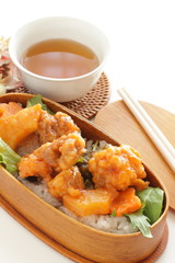Chinese food, sweet and sour pork on rice for lunch box image