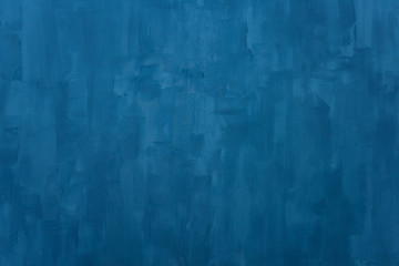 The texture of the blue wall. Artistic application of putty on the wall. Decorative wall in the...