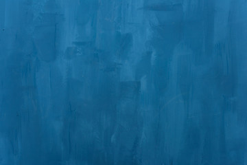 The texture of the blue wall. Artistic application of putty on the wall. Decorative wall in the...