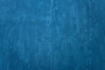 The texture of the blue wall. Artistic application of putty on the wall. Decorative wall in the...