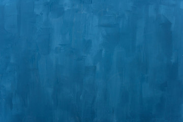 The texture of the blue wall. Artistic application of putty on the wall. Decorative wall in the photo studio