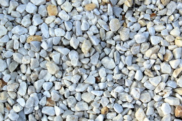 Texture small stones light gray photographed from above