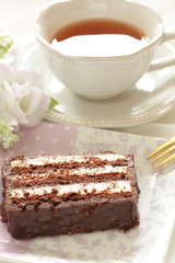 Chocolate cake on dish with copy space