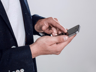 young guy in a jacket talking on the phone