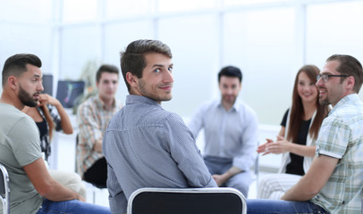 business team sitting in a circle at the company seminar