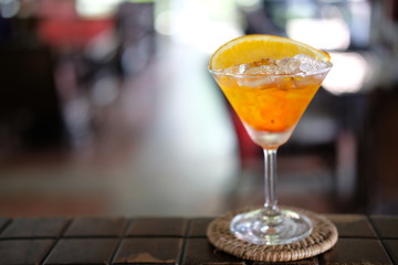 orange margarita cocktail on counter bar
