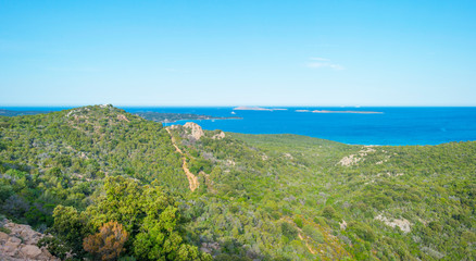 Rocky coast of the island of Sardinia in the Mediterranean Sea in sunlight in spring