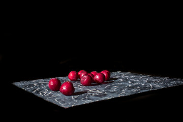 Fresh plums on a black background.