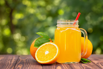 Naklejka na ściany i meble orange juice in mason jar