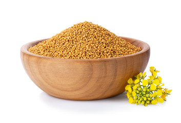 mustard seeds in wooden bowl