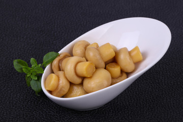 Pickled champignon heap in the bowl
