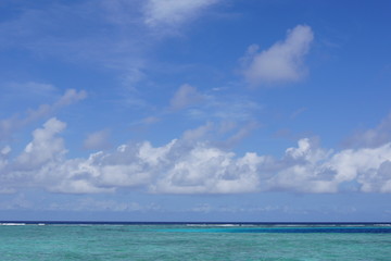 Beautiful sky and turquoise water of the Indian Ocean on a clear day. Maldives