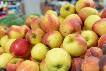 Close-up of fresh, ripe apples on the store counter