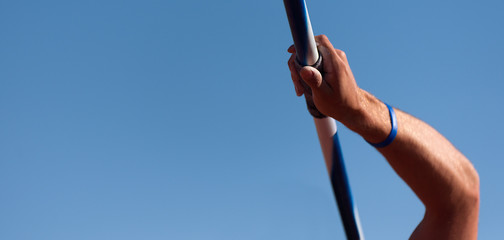 Athlete about to throw a javelin in the stadium