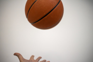 Hand catching a basketball