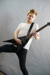Fototapeta premium Man playing on electric guitar