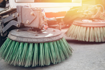 Close-up sweeper machine cleaning. Concept clean streets from debris