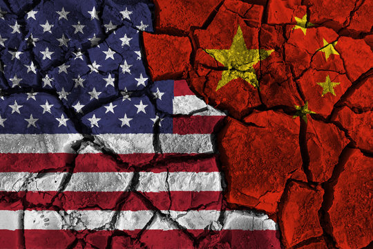 Trade war between United states of america VS China . flag on cracked wall background . Confliction and crisis concept .