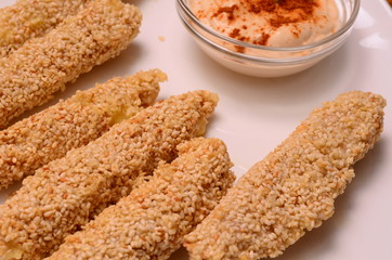 Pile of breaded crab sticks isolated