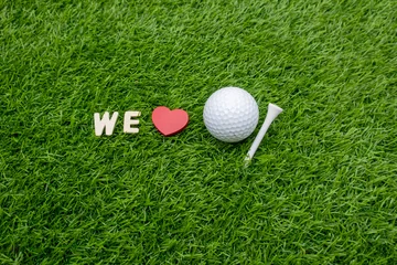 Poster We love golf ball and pin tee on green grass © thaninee