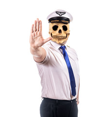 A pilot with skull mask, isolated on white background. Captain of air plane doing gesture of stop and looking to camera.
