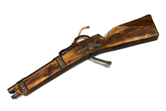 An old historical riffle witch match cord. Poachers gun, beginning of the 20th century, witch matchlock, isolated on white background.