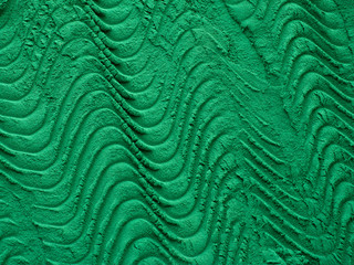 Spirulina algae powder on green background from top view