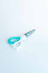children's colourful safe scissors on a white background. scissors made of plastics to avoid injuries.