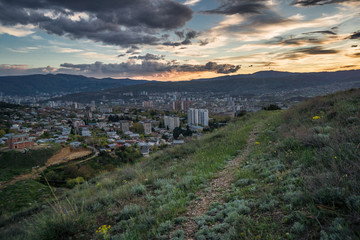 sunset over cityscape in tiflis