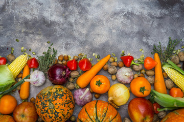 Autumn food background. Thanksgiving dinner ingredients. Autumn vegetables, fruits, nuts