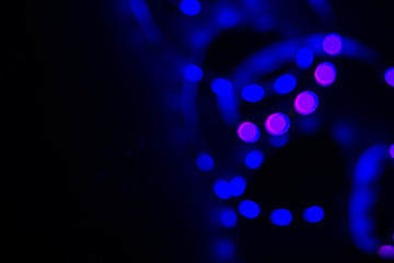 Blue neon blurry spiral led lights on black. Abstract background for your design