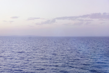 View to the blue  sea from the big ship neart port. Peaceful serene landscape.