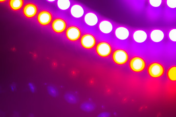 red and purple neon bokeh lights. Festive Abstract background of 80s colors