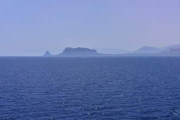 Naklejka na ściany i meble View to the blue sea from the big ship neart port. Peaceful serene landscape.