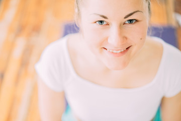 Young woman in sportswear practicing yoga in studio. Fitness sport, yoga and healthy active...