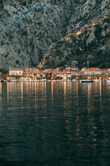Fototapeta na wymiar Panoramas of the night city and fortress. Evening Bay of Kotor, Montenegro.