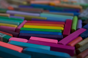 Blurred photo of the LGBT flag from the sticks of artistic pastel. Will serve as the background.