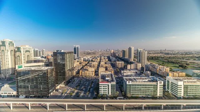 Tecom, Barsha and Greens districts aerial view from Internet city timelapse. Office and residential buildings from above. Cloudy sky
