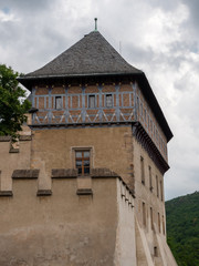 Fototapeta na wymiar Burgrave's House at Karlstejn Castle. A gothic, medieval half timbered house perched over the walls of the royal castle in Bohemia, Czach Republic.