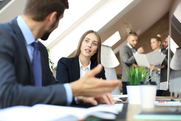 Young business people working on their desktop computers at the modern office space.