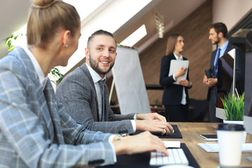 Young business people working on their desktop computers at the modern office space.
