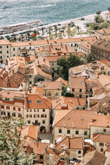  Tiled roofs in Montenegro and Europe. Panorama of the city of Kotor from the height of the mountain.