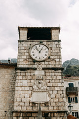 Fototapeta na wymiar Cozy corners of Montenegro. Panorama of the city of Kotor and the details of the streets.