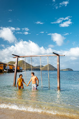 couple on luxury vatation at the tropical Island of Saint Lucia, men and woman by the beach and...