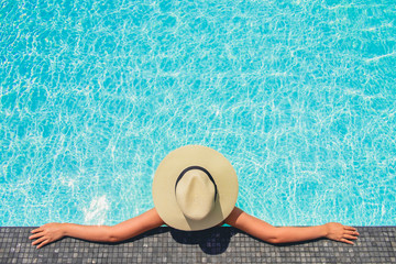 Carefree woman relaxation in swimming pool summer Holiday concept - obrazy, fototapety, plakaty