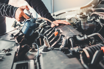 Fototapeta na wymiar Technician Hands of car mechanic working in auto repair Service and Maintenance car